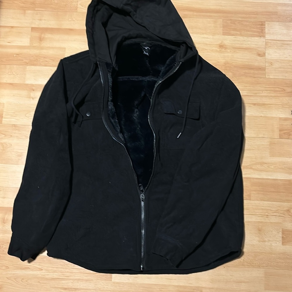 Faux fur lined zip up. Very comfy for cold weather.